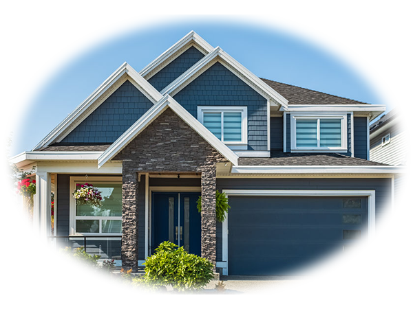 Modern two-story house with blue siding, stone accents, a double garage, and landscaped front yard on a clear day.